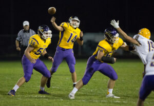 Belvedere quarterback Austin Revolinski (14) passes to a team mate during the first quarter of the varsity football match up against Hononegah at Belvidere High School in Belvidere on Friday, Sep. 25, 2015. Erik Anderson | Belvidere Daily Republican