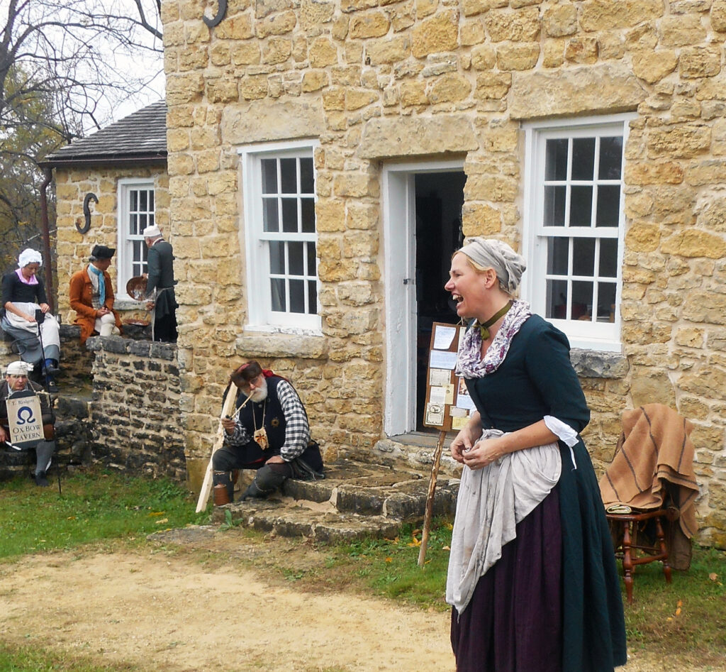 JEAN SEEGERS, PHOTO - The Herald. “Mad Ann Bailey” played by first person reenactor, Susan Thompson, entertained visitors in front of the Whitman Trading Post at Macktown Living History Center, 2221 Freeport Road, in the Macktown Forest Preserve during Frenchman’s Frolic, Oct. 15-16. 