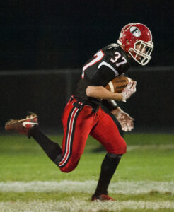 5443: Forreston's Gavin Fuchs runs for a touchdown on their first play of the IHSA Class 1A playoff game in Forreston Friday, Oct. 28.