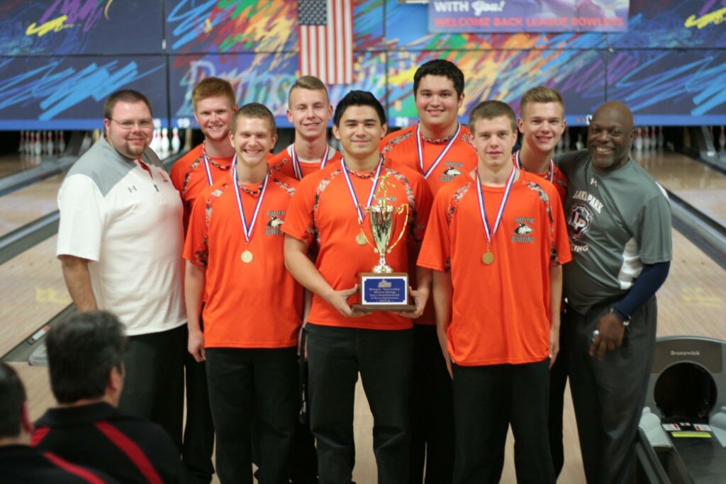 SUBMITTED PHOTO - The Journal. Pictured with the Championship trophy they recently won at the Lake Park Invite are (front row, from left) Harlem Head Boys’ Bowling Coach Nick Whitmire, Noah Mandujano, Dawson Jones and Darby Windsor; (second row, from left) Collin Day, Kyler Gerl, Nick Howard and Jake Nimtz. On the far right is Lake Park Coach Greg Edwards. 