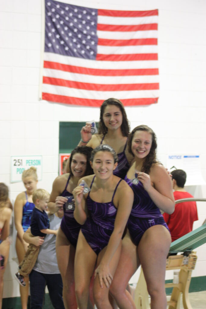 PHOTO COURTESY OF JOHN CARABELLI - The Herald. From left - The 200 Relay team of Kayla Cure, Emily Bax, Julia Carabelli and Madaline Massetti smile after the NIC-10 Varsity Meet. 