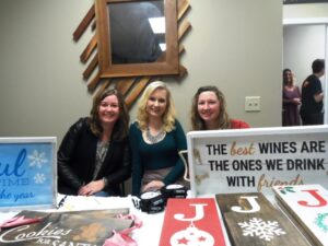 Sarah Doyle, owner of Board & Brush of Roscoe, was joined by Kacie Madl and Tina Dettman.