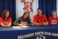 ANNE EICKSTADT PHOTO Belvidere Daily Republican
	Morgan McNulty signs a Letter of Intent to play golf at Lewis University in Romeoville while her family looks on.