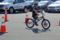 Shane Weber, age 8, rides his brand new bike through the safety course the Belvidere Police Dept. set up.