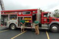 ANNE EICKSTADT PHOTOS Belvidere Daily Republican
	Cpt. Steve Johnson and Firefighter Heath Morrall stand by the rescue truck for North Boone Fire District 3 at the Celebrate CommUnity event.
