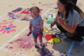 ANNE EICKSTADT PHOTO Belvidere Daily Republican
	Sophia Shableau, age 1 ½, really gets involved in Paint the Hill as mom Ashley helps.