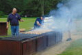 ANNE EICKSTADT PHOTO Belvidere Republican
	Captain Holmes counts the first batch of chickens to be barbequed at the joint Capron Firefighter and Lions Club fundraiser.
