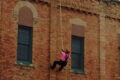 ANNE EICKSTADT PHOTO Belvidere Republican
	Firefighters demonstrate their skills at rope opera-tions by rappelling down the side of the fire station during the open house.