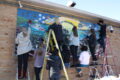 SUBMITTED PHOTO Belvidere Republican
	Students diligently repaint the VFW mural to its original clear, bright colors.