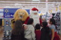 ANNE EICKSTADT PHOTO Belvidere Republican
	A group of kids at Walmart discover the Lions’ mascot and Santa Claus strolling the aisles.