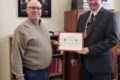 COURTESY PHOTO Belvidere Republican
	Sheriff Ernest presents Pastor Dan Pope with a Certificate of Appreciation for the efforts of members of the Open Bible Church of Belvidere in making Boone County a more beautiful place.