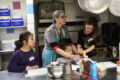 ANNE EICKSTADT PHOTOS Belvidere RepublicanNicole O’Neill, dietician, has the kids actively help her make a banana wrap snack in the YMCA kitchen during the Safety Bowl.
