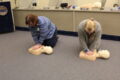 ANNE EICKSTADT PHOTO Belvidere Republican
	Members of Beck’s CPR class practice doing compressions on CPR mannequins.