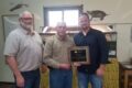 SUBMITTED PHOTO Belvidere Republican
	Craig Johnson, Farm Manager, K-B Farms Inc., accepts plaque recognizing the donation of land to the Boone County Conservation District.  Pictured from left to right: Dan Kane, BCCD Executive Director; Craig Johnson, K-B Farm Manager; and Matt Bullard, BCCD Board President.