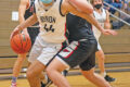 Max Connell drives to the basket past Stillman Valley's Brandt King during the third quarter of their game in Byron on Monday, Feb. 22, 2021. Byron won the game 59-48.