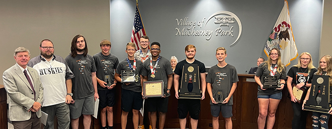 Village board recognizes two Harlem national bowling champions