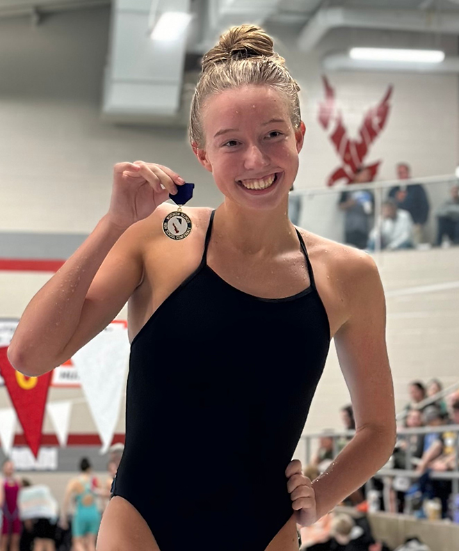 Harlem swimmer takes first at State meet