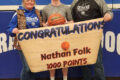 TRENTEN SCHEIDEGGER PHOTO The Gazette
	Folk (center) surrounded by his parents Amy McIntosh and Nick Folk with the 1,000-point game ball.