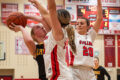 The Lady Cardinals put up a stiff defense to win the semifinal game against Riverdale at the Oregon Sectional on Tuesday, Feb. 20. Here, Stillman's Amelia Dunseth, center, and Payge Barger block a shot by Riverdale's Alexis Duke in the first quarter.
