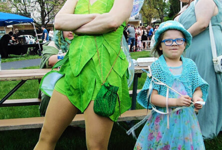 MARIANNE MUELLER PHOTO The Herald
	Tinkerbell (Andrea Gantz, at left) volunteered with "League of Enchantment," a non profit charity group work organization greeted a visitor at the 2024 Rockton May Day Faerie Festival.