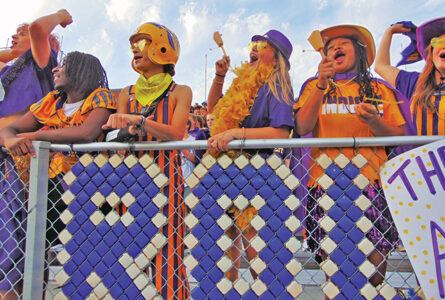 MARIANNE MUELLER PHOTO The Herald
	Hononegah High School students in the front row of the student section showed full school spirit at the 2024 Purple and Gold Festival on Friday evening, Aug. 23.