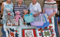 SUBMITTED PHOTO The Gazette
	From left: Sandra Elliott, Lola Moist, Vi Johns, and Martha Gale show off items you will see at the Nov. 9 Holiday House Bazaar at the Pecatonica United Methodist Women. Quilt raffle tickets are available now and they will draw at noon during the bazaar.