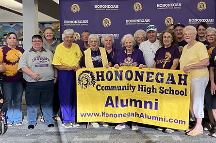 MARIANNE MUELLER PHOTO The Herald
	Hononegah Alumni gathered for a photo in the HCHS library during Homecoming festivities.