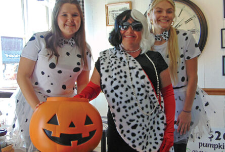 MARIANNE MUELLER PHOTOS The Herald
	Diana Weiser, dressed as Cruella Deville, of DeeDees Coffee and Décor and her employees donned 101 Dalmatian costumes.