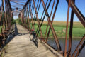 PHOTO COURTESY GREG VASSMER The Gazette
	A bicyclist rides the trail just west of the Winnebago County Fairgrounds in Pecatonica. The C&NW bridge over the Pecatonica River about 1-1/2 miles west of Ridott. The Pecatonica Prairie Trail is a great place for bicyclists. The trail follows the C&NW right-of-way and is around 30 miles. The trail crosses many different types of landscape and, for much of the way, is also part of the 575 mile bike trail Grand Illinois Trail, which is itself a part of the 3,700 mile coast-to-coast Great American Rail Trail.