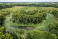 PHOTO COURTESY BRADY TRYLONG DRONE SOLUTIONS The Gazette
	Horseshoe shaped oxbow on the former Hazel Doty property now owned by NLI.