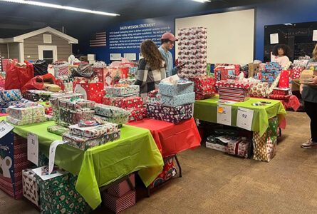 COURTESY PHOTO The Herald
	Volunteers prepared gifts to be given to local families and children.