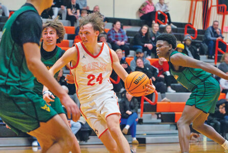 HUSKIE FAN FAVORITES PHOTO The Journal
	Matt Saunders looks for driving room against Waubonsie Valley, Jan. 3, at Harlem. The Huskies fell to the Warriors, 67-39.