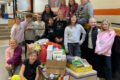 SUBMITTED PHOTO Tempo
	The K-Kids, led by Mrs. Brittany Stavnem, organized a huge collection of non-perishables and delivered them at the beginning of December to help with the Christmas grocery bags. The kids delivered the food and met with Mrs. Susan Freyer, who explained the pantry and gave them a tour.