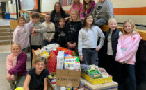 SUBMITTED PHOTO Tempo
	The K-Kids, led by Mrs. Brittany Stavnem, organized a huge collection of non-perishables and delivered them at the beginning of December to help with the Christmas grocery bags. The kids delivered the food and met with Mrs. Susan Freyer, who explained the pantry and gave them a tour.