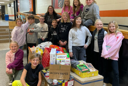 SUBMITTED PHOTO Tempo
	The K-Kids, led by Mrs. Brittany Stavnem, organized a huge collection of non-perishables and delivered them at the beginning of December to help with the Christmas grocery bags. The kids delivered the food and met with Mrs. Susan Freyer, who explained the pantry and gave them a tour.