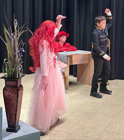 COURTESY PHOTO The HeraldEric and Ariel danced while Sebastian looks on.