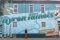 SUBMITTED PHOTO Tempo
	On July 18, Byron held a ribbon cutting for the completion of their fourth downtown mural, “Community and Connection,” by artist Nicole Arand (center).